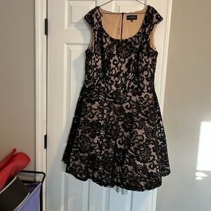 Gorgeous stretchy black and nude lace dress with tulle underneath.